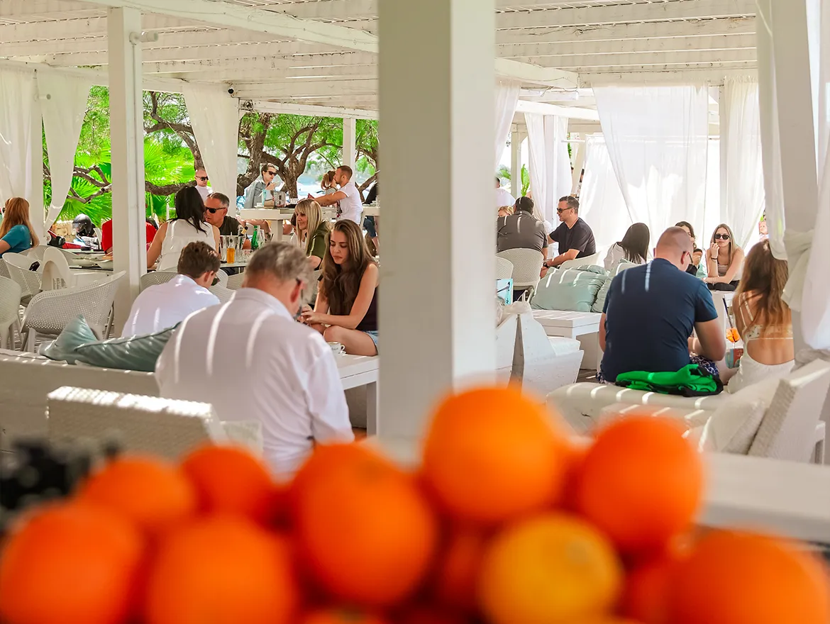 Restaurant tables by the sea at Shark Beach Bar
